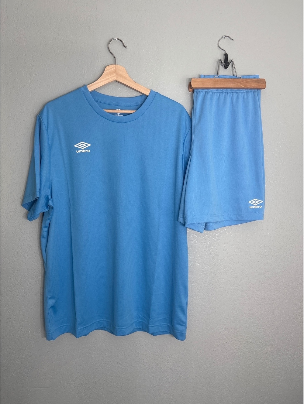 Men’s umbro set NWOT  shirt and shorts. Light blue soccer